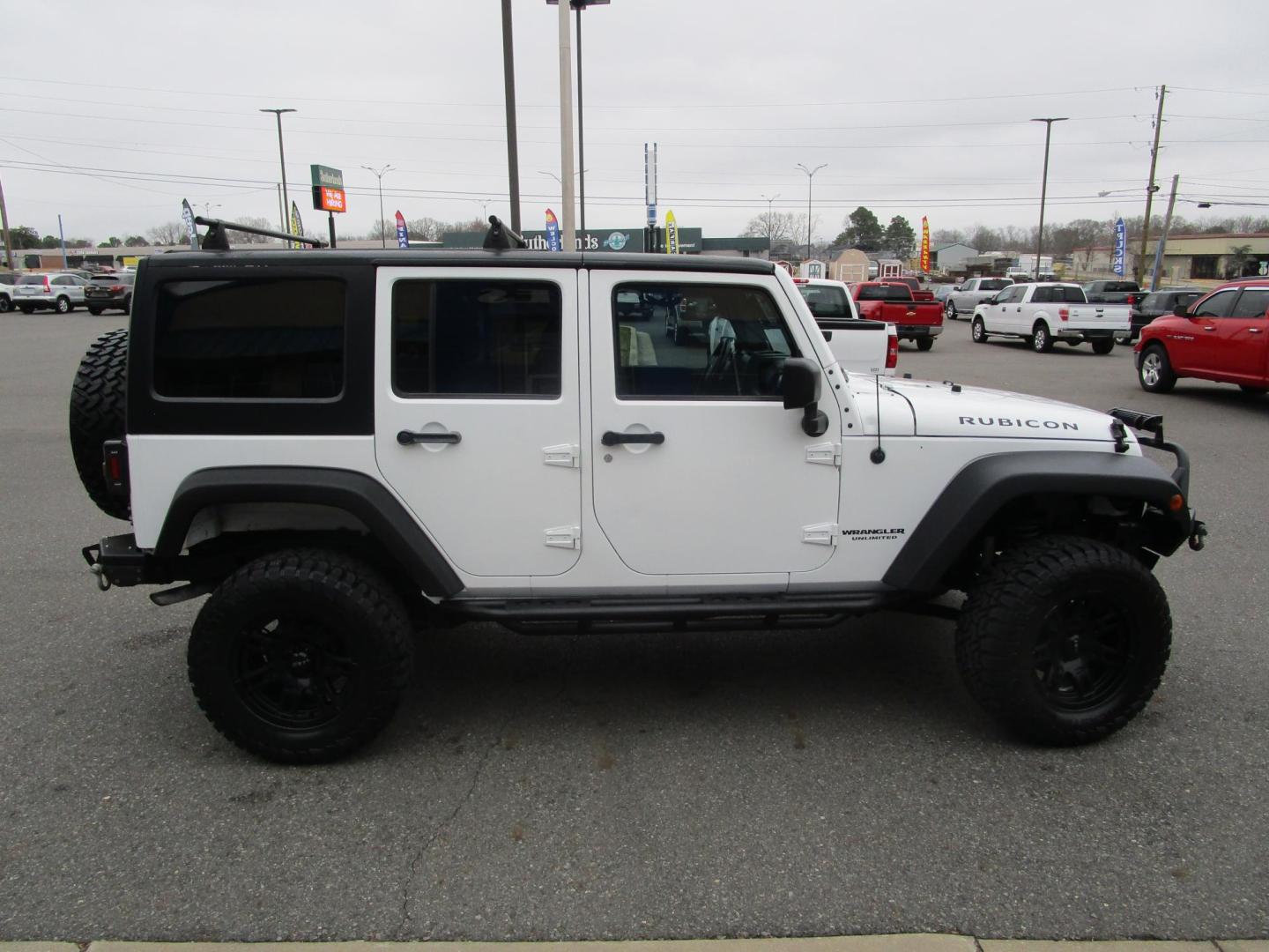 2012 WHITE /Tan/Leather Jeep Wrangler Unlimited Rubicon 4WD (1C4HJWFG9CL) with an 3.6L V6 DOHC 24V FFV engine, located at 1814 Albert Pike Road, Hot Springs, AR, 71913, (501) 623-1717, 34.494228, -93.094070 - Photo#2