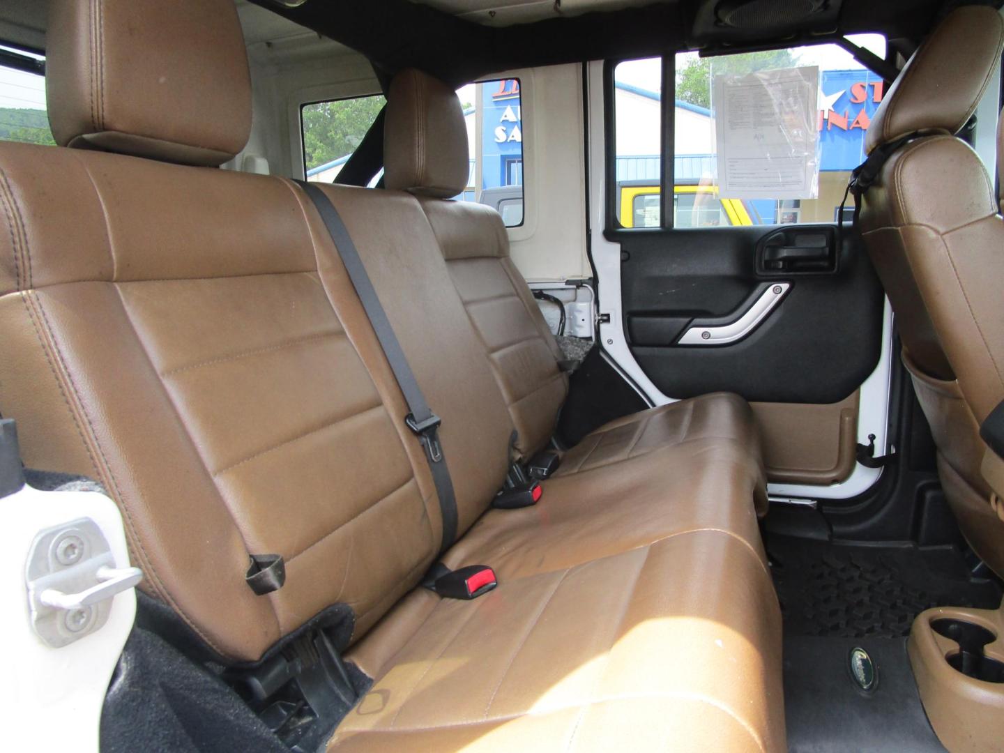 2012 WHITE /Tan/Leather Jeep Wrangler Unlimited Rubicon 4WD (1C4HJWFG9CL) with an 3.6L V6 DOHC 24V FFV engine, located at 1814 Albert Pike Road, Hot Springs, AR, 71913, (501) 623-1717, 34.494228, -93.094070 - Photo#6