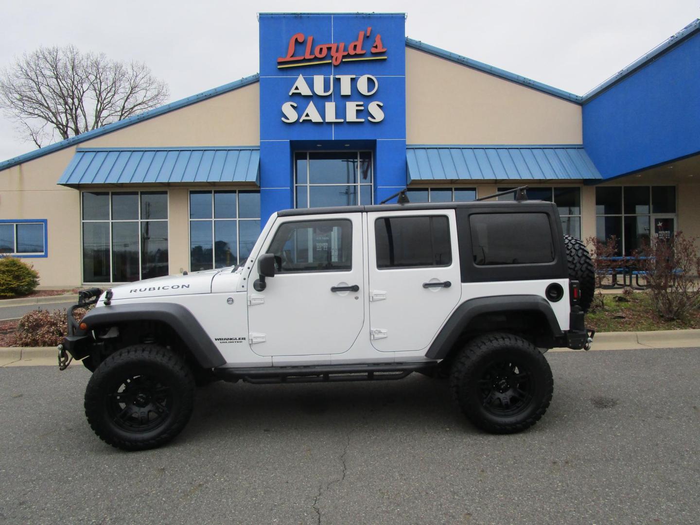2012 WHITE /Tan/Leather Jeep Wrangler Unlimited Rubicon 4WD (1C4HJWFG9CL) with an 3.6L V6 DOHC 24V FFV engine, located at 1814 Albert Pike Road, Hot Springs, AR, 71913, (501) 623-1717, 34.494228, -93.094070 - Photo#0