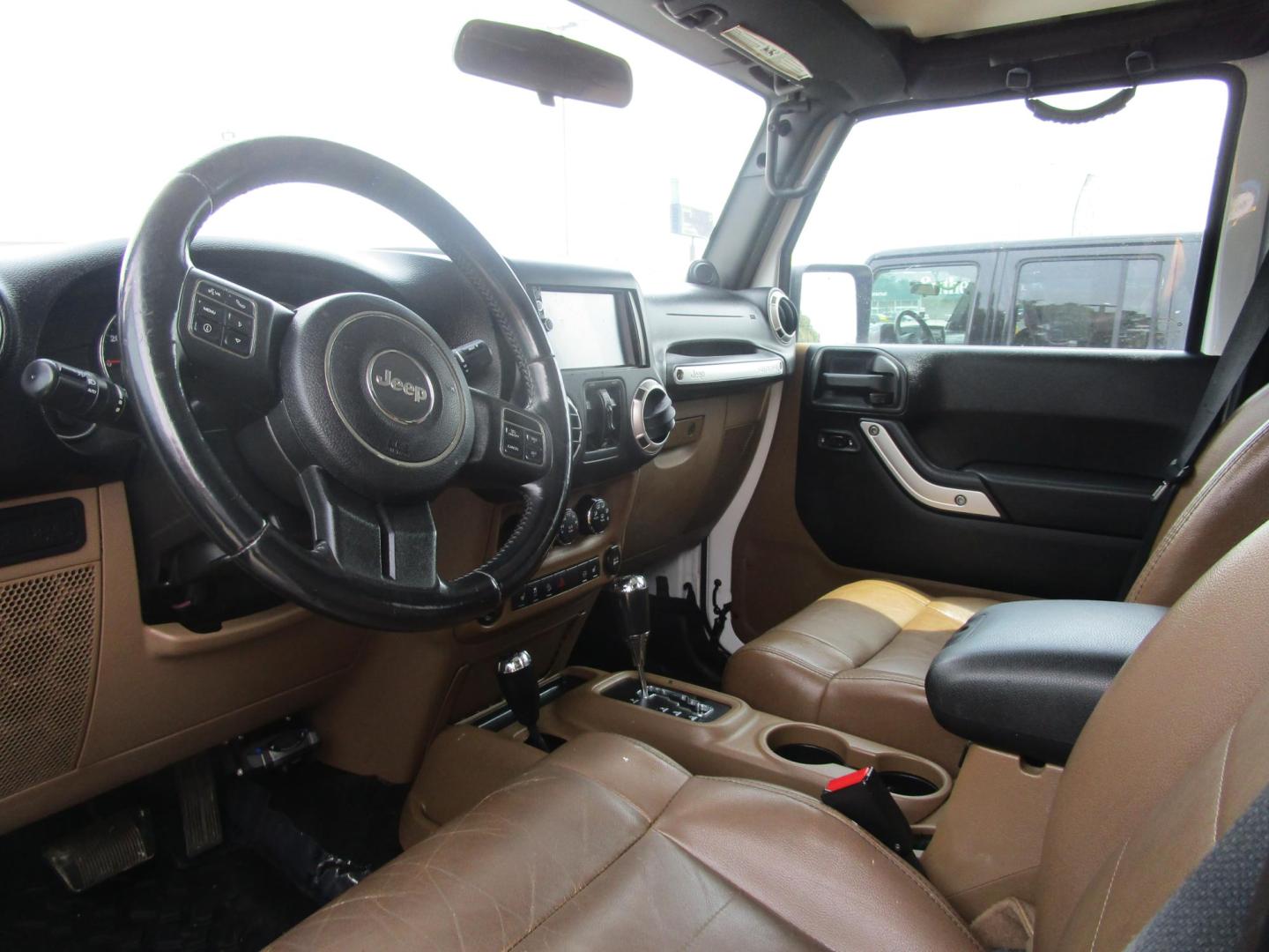 2012 WHITE /Tan/Leather Jeep Wrangler Unlimited Rubicon 4WD (1C4HJWFG9CL) with an 3.6L V6 DOHC 24V FFV engine, located at 1814 Albert Pike Road, Hot Springs, AR, 71913, (501) 623-1717, 34.494228, -93.094070 - Photo#4