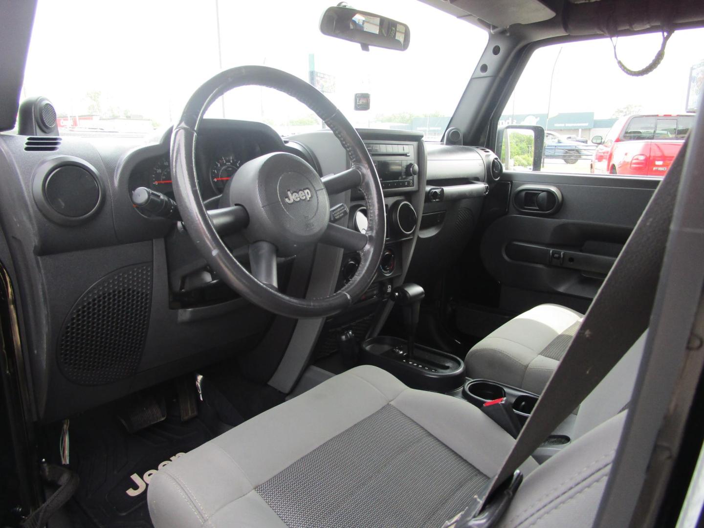 2009 BLACK /Gray/Cloth Jeep Wrangler Unlimited X 4WD (1J4GA39199L) with an 3.8L V6 OHV 12V engine, located at 1814 Albert Pike Road, Hot Springs, AR, 71913, (501) 623-1717, 34.494228, -93.094070 - Photo#6