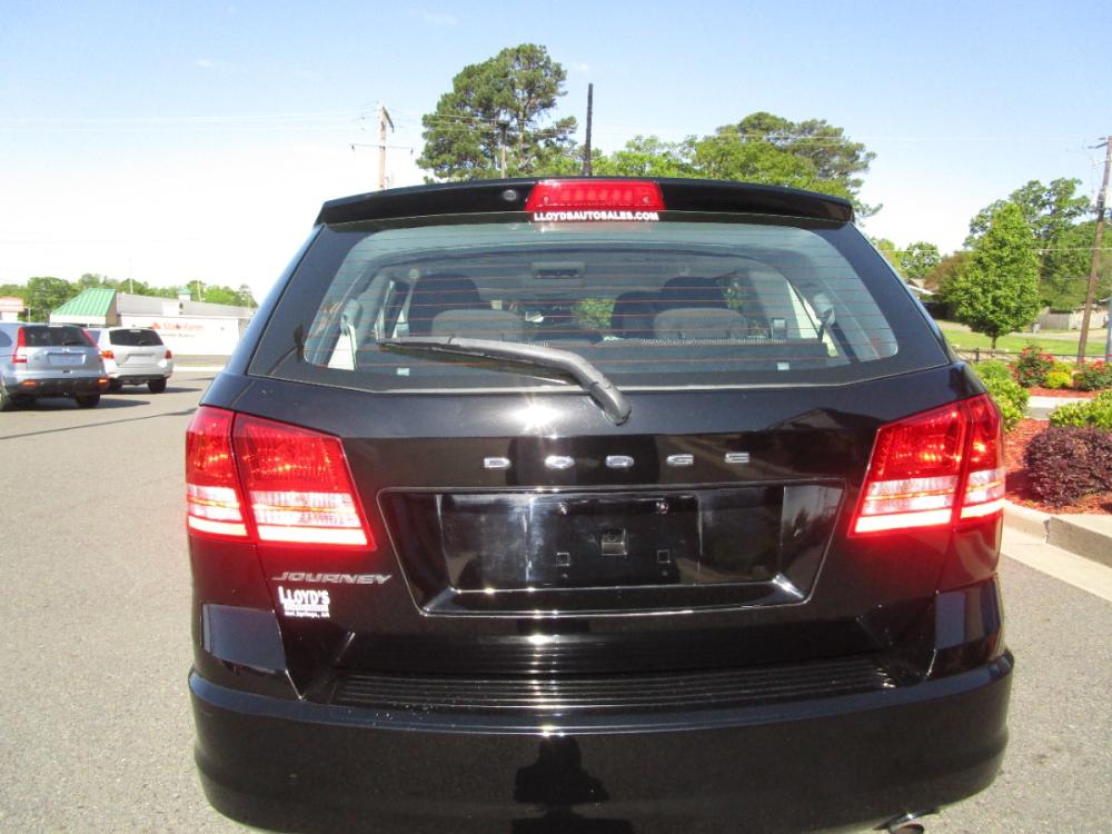 2014 BLACK /Black / Cloth Dodge Journey SE (3C4PDCABXET) with an 2.4L L4 DOHC 16V engine, 4-Speed Automatic transmission, located at 1814 Albert Pike Road, Hot Springs, AR, 71913, (501) 623-1717, 34.494228, -93.094070 - Photo #4