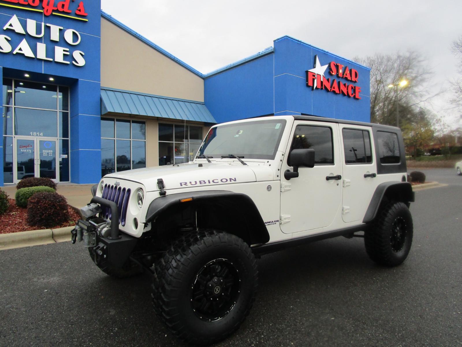 2010 WHITE /Black / Cloth Jeep Wrangler Unlimited Rubicon 4WD (1J4BA6H11AL) with an 3.8L V6 OHV 12V engine, located at 1814 Albert Pike Road, Hot Springs, AR, 71913, (501) 623-1717, 34.494228, -93.094070 - Photo #1
