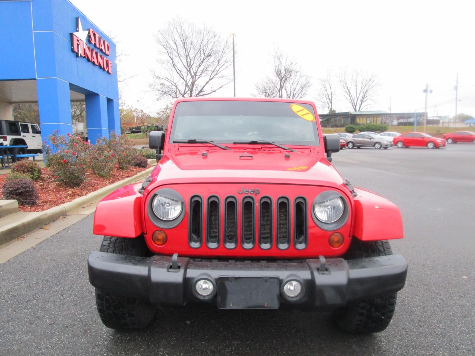 2011 RED /Gray / Cloth Jeep Wrangler Unlimited Sahara 4WD (1J4BA5H11BL) with an 3.8L V6 OHV 12V engine, located at 1814 Albert Pike Road, Hot Springs, AR, 71913, (501) 623-1717, 34.494228, -93.094070 - Photo #2