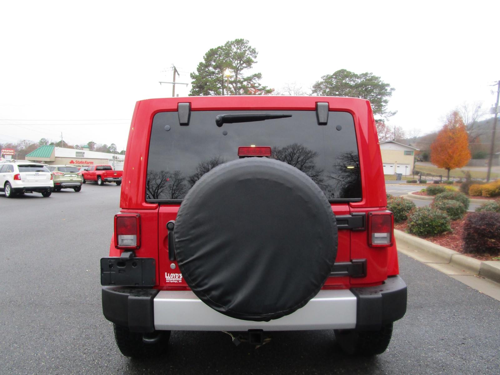 2011 RED /Gray / Cloth Jeep Wrangler Unlimited Sahara 4WD (1J4BA5H11BL) with an 3.8L V6 OHV 12V engine, located at 1814 Albert Pike Road, Hot Springs, AR, 71913, (501) 623-1717, 34.494228, -93.094070 - Photo #4