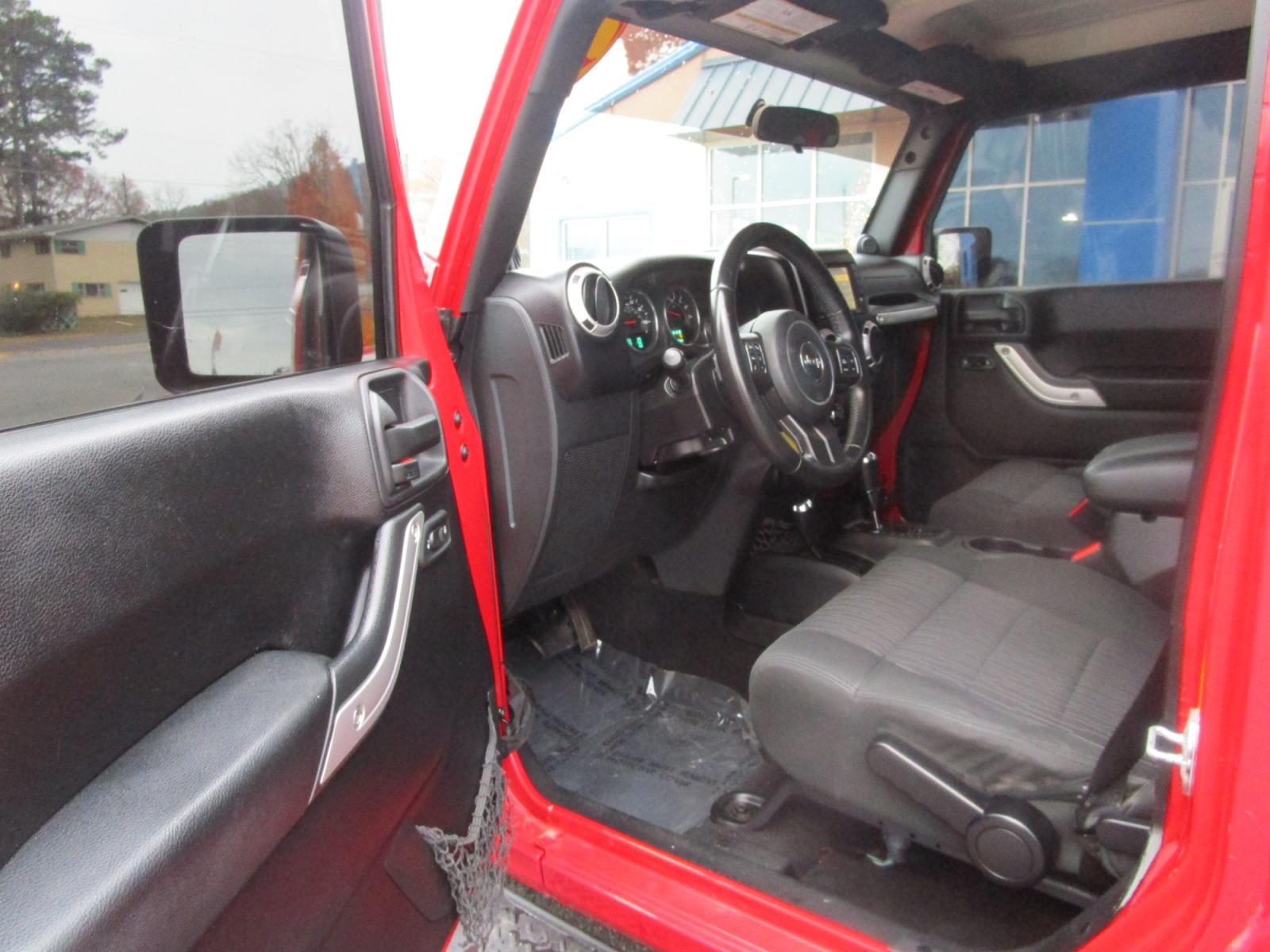 2011 RED /Gray / Cloth Jeep Wrangler Unlimited Sahara 4WD (1J4BA5H11BL) with an 3.8L V6 OHV 12V engine, located at 1814 Albert Pike Road, Hot Springs, AR, 71913, (501) 623-1717, 34.494228, -93.094070 - Photo #7