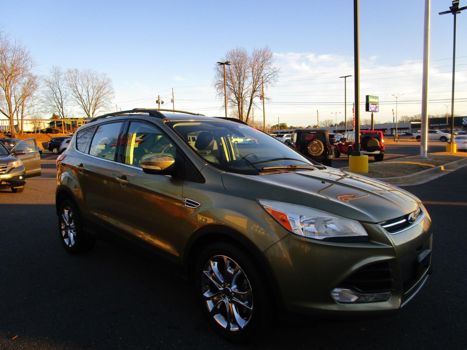 2013 Green /Black / Leather Ford Escape SEL FWD (1FMCU0HX4DU) with an 1.6L L4 DOHC 16V engine, 6-Speed Automatic transmission, located at 1814 Albert Pike Road, Hot Springs, AR, 71913, (501) 623-1717, 34.494228, -93.094070 - Photo #3