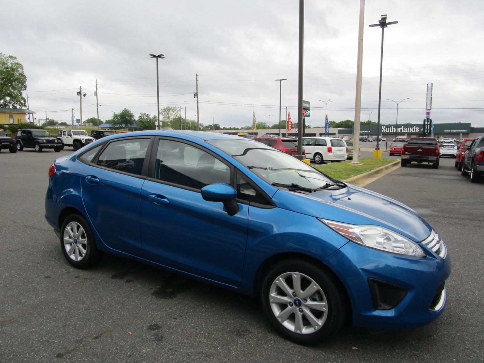 2012 Blue /Gray / Cloth Ford Fiesta SE Sedan (3FADP4BJ6CM) with an 1.6L L4 DOHC 16V engine, located at 1814 Albert Pike Road, Hot Springs, AR, 71913, (501) 623-1717, 34.494228, -93.094070 - Photo #3