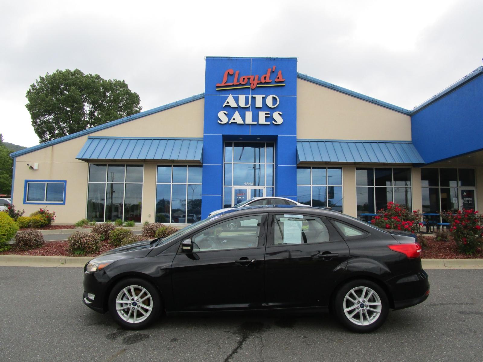 2016 BLACK /Gray / Cloth Ford Focus SE Sedan (1FADP3F22GL) with an 2.0L L4 DOHC 16V engine, located at 1814 Albert Pike Road, Hot Springs, AR, 71913, (501) 623-1717, 34.494228, -93.094070 - Photo #0