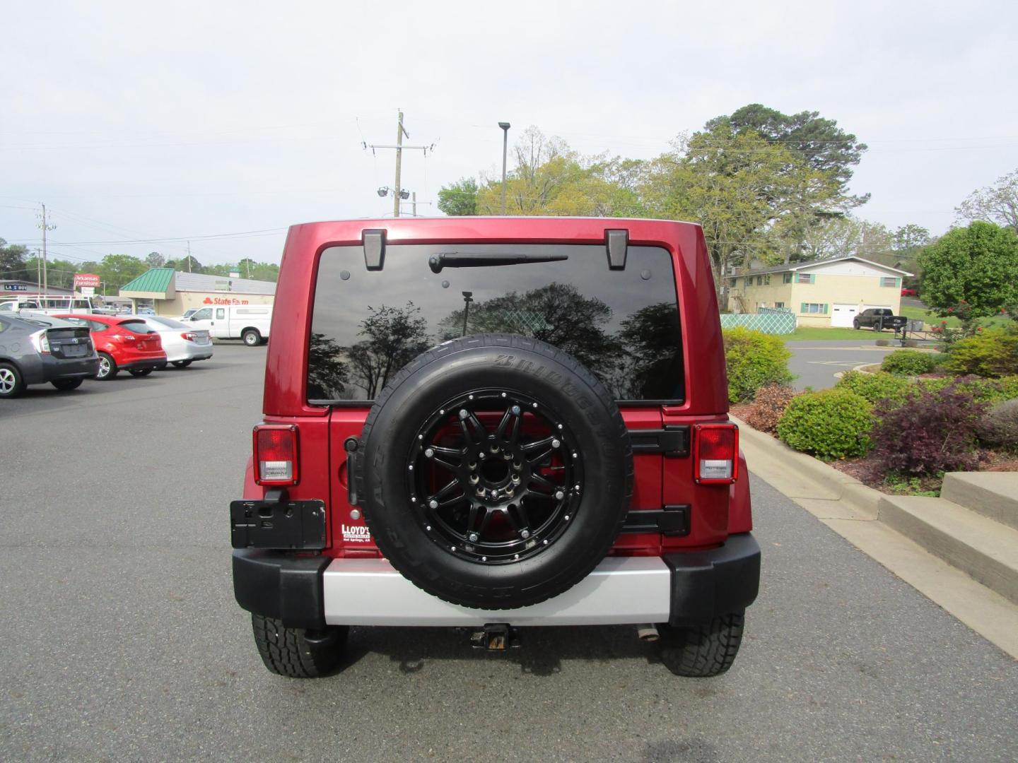 2013 MAROON /Black / Leather Jeep Wrangler Unlimited Sahara 4WD (1C4BJWEG9DL) with an 3.6L V6 DOHC 24V FFV engine, located at 1814 Albert Pike Road, Hot Springs, AR, 71913, (501) 623-1717, 34.494228, -93.094070 - Photo#3