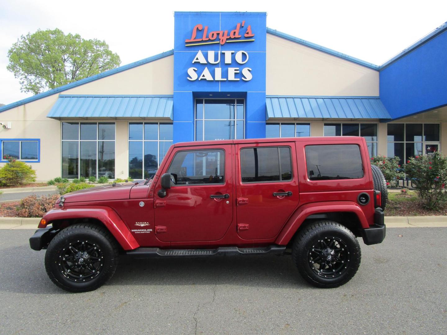 2013 MAROON /Black / Leather Jeep Wrangler Unlimited Sahara 4WD (1C4BJWEG9DL) with an 3.6L V6 DOHC 24V FFV engine, located at 1814 Albert Pike Road, Hot Springs, AR, 71913, (501) 623-1717, 34.494228, -93.094070 - Photo#0