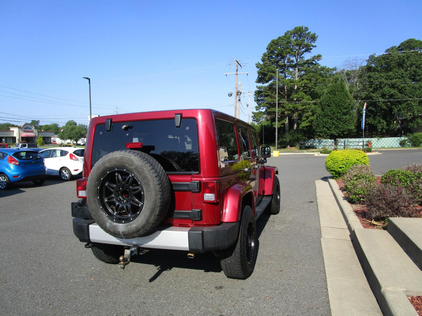 2013 MAROON /Black / Leather Jeep Wrangler Unlimited Sahara 4WD (1C4BJWEG9DL) with an 3.6L V6 DOHC 24V FFV engine, located at 1814 Albert Pike Road, Hot Springs, AR, 71913, (501) 623-1717, 34.494228, -93.094070 - Photo#11