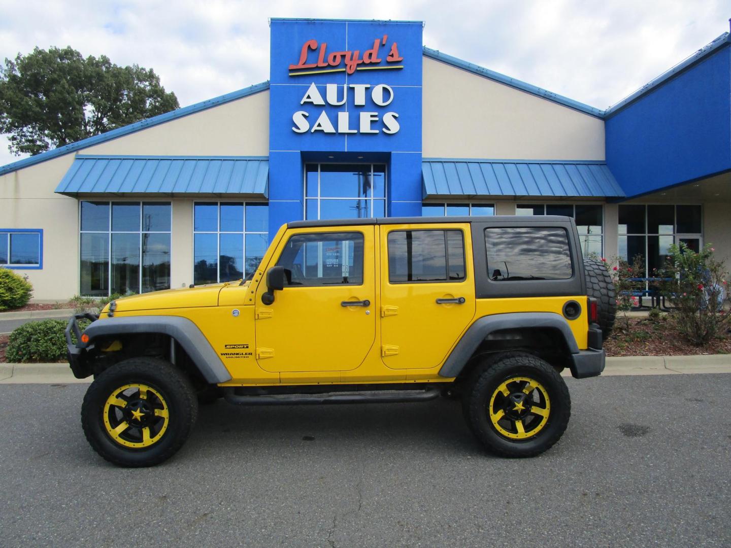 2015 Yellow /YELLOW/BLACK Jeep Wrangler Unlimited Sport 4WD (1C4BJWDG8FL) with an 3.6L V6 DOHC 24V FFV engine, located at 1814 Albert Pike Road, Hot Springs, AR, 71913, (501) 623-1717, 34.494228, -93.094070 - 2015 Jeep Wrangler Unlimited Sport 4X4 3.6L V6 24-Valve VVT Engine. 5 Speed Automatic Transmission. Exterior Features: "Trail Rated" Badge. Sunrider Soft Top. Full Metal Doors with Roll-up Windows. Fog Lamps. 2 Front Tow Hooks and 1 Rear Tow Hook. Interior Features: Rearview Day/Night Mirr - Photo#0