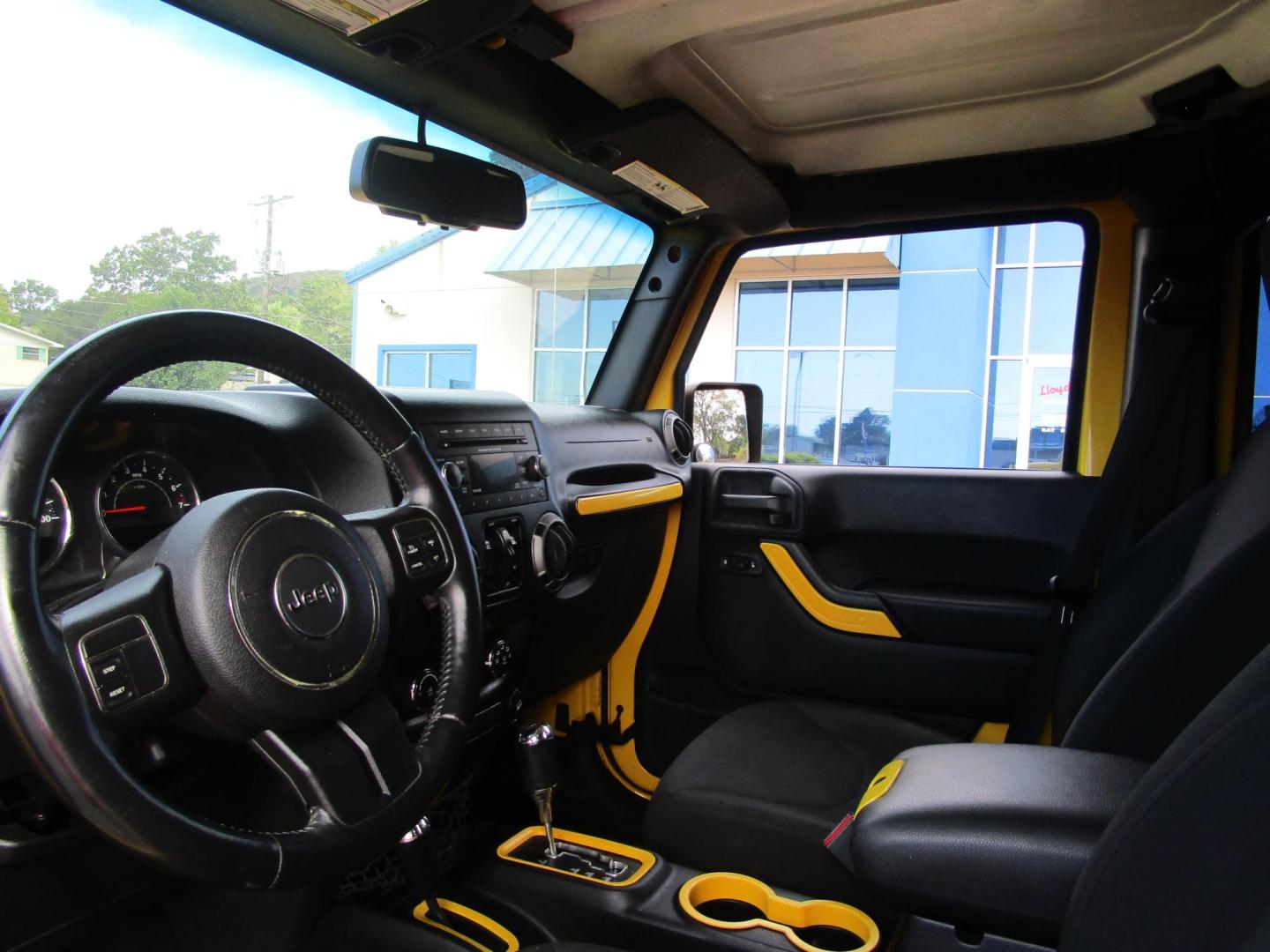 2015 Yellow /YELLOW/BLACK Jeep Wrangler Unlimited Sport 4WD (1C4BJWDG8FL) with an 3.6L V6 DOHC 24V FFV engine, located at 1814 Albert Pike Road, Hot Springs, AR, 71913, (501) 623-1717, 34.494228, -93.094070 - 2015 Jeep Wrangler Unlimited Sport 4X4 3.6L V6 24-Valve VVT Engine. 5 Speed Automatic Transmission. Exterior Features: "Trail Rated" Badge. Sunrider Soft Top. Full Metal Doors with Roll-up Windows. Fog Lamps. 2 Front Tow Hooks and 1 Rear Tow Hook. Interior Features: Rearview Day/Night Mirr - Photo#5