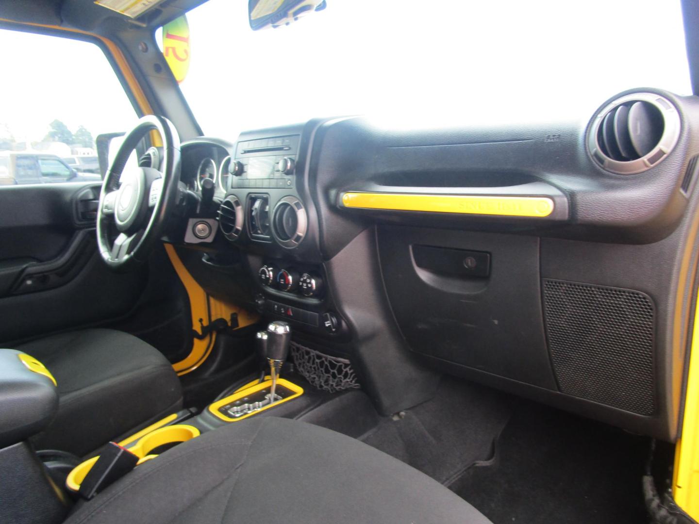 2015 Yellow /YELLOW/BLACK Jeep Wrangler Unlimited Sport 4WD (1C4BJWDG8FL) with an 3.6L V6 DOHC 24V FFV engine, located at 1814 Albert Pike Road, Hot Springs, AR, 71913, (501) 623-1717, 34.494228, -93.094070 - 2015 Jeep Wrangler Unlimited Sport 4X4 3.6L V6 24-Valve VVT Engine. 5 Speed Automatic Transmission. Exterior Features: "Trail Rated" Badge. Sunrider Soft Top. Full Metal Doors with Roll-up Windows. Fog Lamps. 2 Front Tow Hooks and 1 Rear Tow Hook. Interior Features: Rearview Day/Night Mirr - Photo#6
