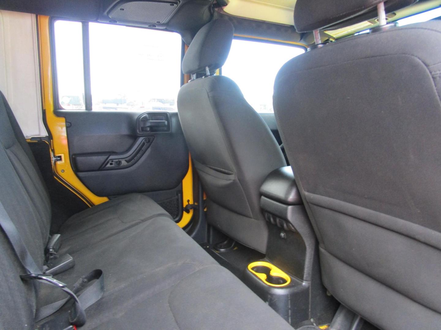 2015 Yellow /YELLOW/BLACK Jeep Wrangler Unlimited Sport 4WD (1C4BJWDG8FL) with an 3.6L V6 DOHC 24V FFV engine, located at 1814 Albert Pike Road, Hot Springs, AR, 71913, (501) 623-1717, 34.494228, -93.094070 - 2015 Jeep Wrangler Unlimited Sport 4X4 3.6L V6 24-Valve VVT Engine. 5 Speed Automatic Transmission. Exterior Features: "Trail Rated" Badge. Sunrider Soft Top. Full Metal Doors with Roll-up Windows. Fog Lamps. 2 Front Tow Hooks and 1 Rear Tow Hook. Interior Features: Rearview Day/Night Mirr - Photo#7