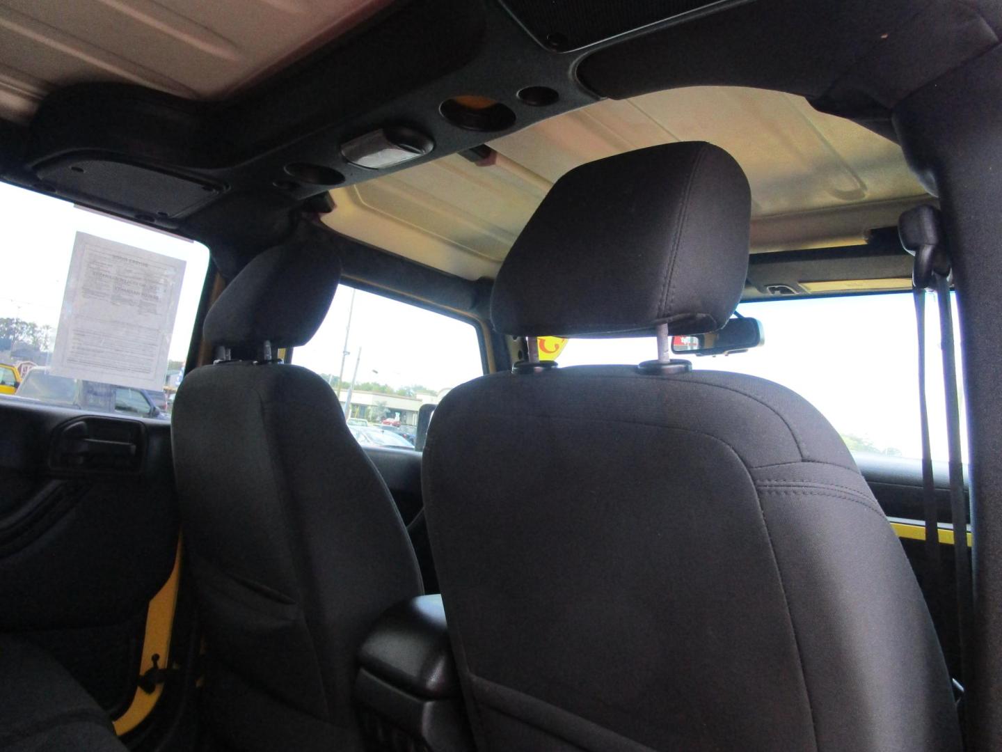 2015 Yellow /YELLOW/BLACK Jeep Wrangler Unlimited Sport 4WD (1C4BJWDG8FL) with an 3.6L V6 DOHC 24V FFV engine, located at 1814 Albert Pike Road, Hot Springs, AR, 71913, (501) 623-1717, 34.494228, -93.094070 - 2015 Jeep Wrangler Unlimited Sport 4X4 3.6L V6 24-Valve VVT Engine. 5 Speed Automatic Transmission. Exterior Features: "Trail Rated" Badge. Sunrider Soft Top. Full Metal Doors with Roll-up Windows. Fog Lamps. 2 Front Tow Hooks and 1 Rear Tow Hook. Interior Features: Rearview Day/Night Mirr - Photo#9