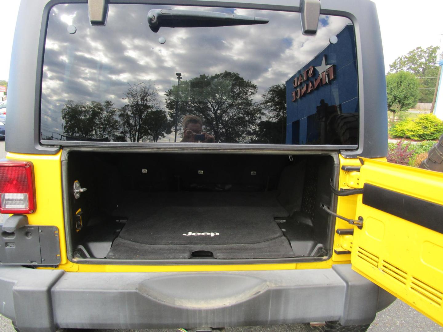 2015 Yellow /YELLOW/BLACK Jeep Wrangler Unlimited Sport 4WD (1C4BJWDG8FL) with an 3.6L V6 DOHC 24V FFV engine, located at 1814 Albert Pike Road, Hot Springs, AR, 71913, (501) 623-1717, 34.494228, -93.094070 - 2015 Jeep Wrangler Unlimited Sport 4X4 3.6L V6 24-Valve VVT Engine. 5 Speed Automatic Transmission. Exterior Features: "Trail Rated" Badge. Sunrider Soft Top. Full Metal Doors with Roll-up Windows. Fog Lamps. 2 Front Tow Hooks and 1 Rear Tow Hook. Interior Features: Rearview Day/Night Mirr - Photo#10
