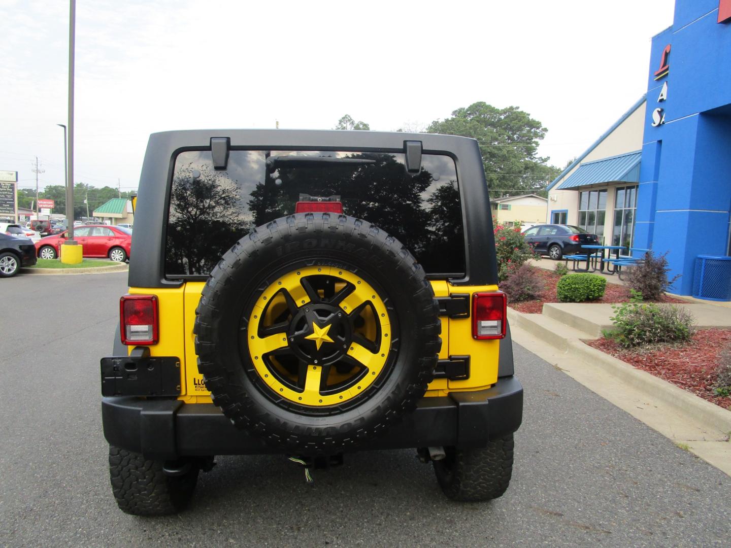 2015 Yellow /YELLOW/BLACK Jeep Wrangler Unlimited Sport 4WD (1C4BJWDG8FL) with an 3.6L V6 DOHC 24V FFV engine, located at 1814 Albert Pike Road, Hot Springs, AR, 71913, (501) 623-1717, 34.494228, -93.094070 - 2015 Jeep Wrangler Unlimited Sport 4X4 3.6L V6 24-Valve VVT Engine. 5 Speed Automatic Transmission. Exterior Features: "Trail Rated" Badge. Sunrider Soft Top. Full Metal Doors with Roll-up Windows. Fog Lamps. 2 Front Tow Hooks and 1 Rear Tow Hook. Interior Features: Rearview Day/Night Mirr - Photo#3