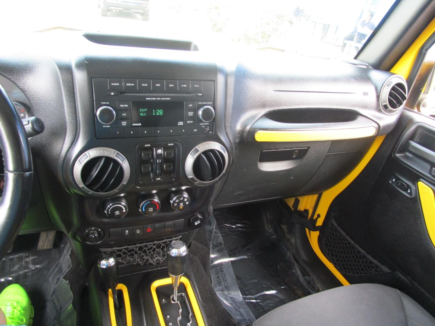 2015 Yellow /YELLOW/BLACK Jeep Wrangler Unlimited Sport 4WD (1C4BJWDG8FL) with an 3.6L V6 DOHC 24V FFV engine, located at 1814 Albert Pike Road, Hot Springs, AR, 71913, (501) 623-1717, 34.494228, -93.094070 - 2015 Jeep Wrangler Unlimited Sport 4X4 3.6L V6 24-Valve VVT Engine. 5 Speed Automatic Transmission. Exterior Features: "Trail Rated" Badge. Sunrider Soft Top. Full Metal Doors with Roll-up Windows. Fog Lamps. 2 Front Tow Hooks and 1 Rear Tow Hook. Interior Features: Rearview Day/Night Mirr - Photo#4
