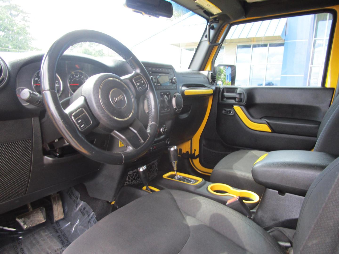 2015 Yellow /YELLOW/BLACK Jeep Wrangler Unlimited Sport 4WD (1C4BJWDG8FL) with an 3.6L V6 DOHC 24V FFV engine, AUTOMATIC transmission, located at 1814 Albert Pike Road, Hot Springs, AR, 71913, (501) 623-1717, 34.494228, -93.094070 - 2015 Jeep Wrangler Unlimited Sport 4X4 3.6L V6 24-Valve VVT Engine. 5 Speed Automatic Transmission. Exterior Features: "Trail Rated" Badge. Sunrider Soft Top. Full Metal Doors with Roll-up Windows. Fog Lamps. 2 Front Tow Hooks and 1 Rear Tow Hook. Interior Features: Rearview Day/Night Mirr - Photo#6