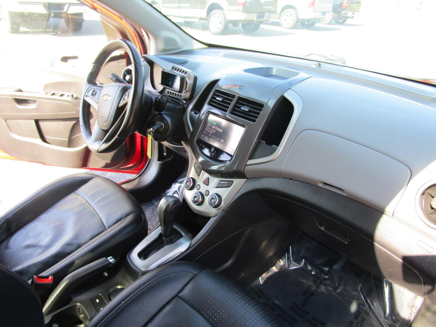 2015 RED /Black / Leather Chevrolet Sonic LTZ Auto Sedan (1G1JE5SB4F4) with an 1.4L L4 DOHC 24V TURBO engine, 6-Speed Automatic transmission, located at 1814 Albert Pike Road, Hot Springs, AR, 71913, (501) 623-1717, 34.494228, -93.094070 - Photo#4