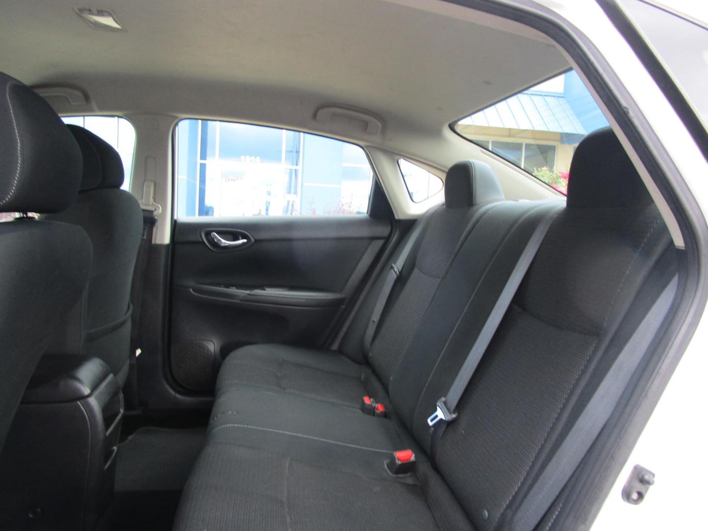 2019 WHITE /BLACK Nissan Sentra S CVT (3N1AB7AP3KY) with an 1.8L L4 SFI DOHC 16V engine, CVT transmission, located at 1814 Albert Pike Road, Hot Springs, AR, 71913, (501) 623-1717, 34.494228, -93.094070 - Mechanical & Performance Features: 1.8L DOHC 4-cylinder Engine. 6 Speed Manual transmission. Eco mode. Front and rear stabilizer bars. power-assisted vented front disc / rear drum brakes. Safety & Security Features: Lower anchors & tethers for children (Latch). Anti-lock braking system. Traction - Photo#6