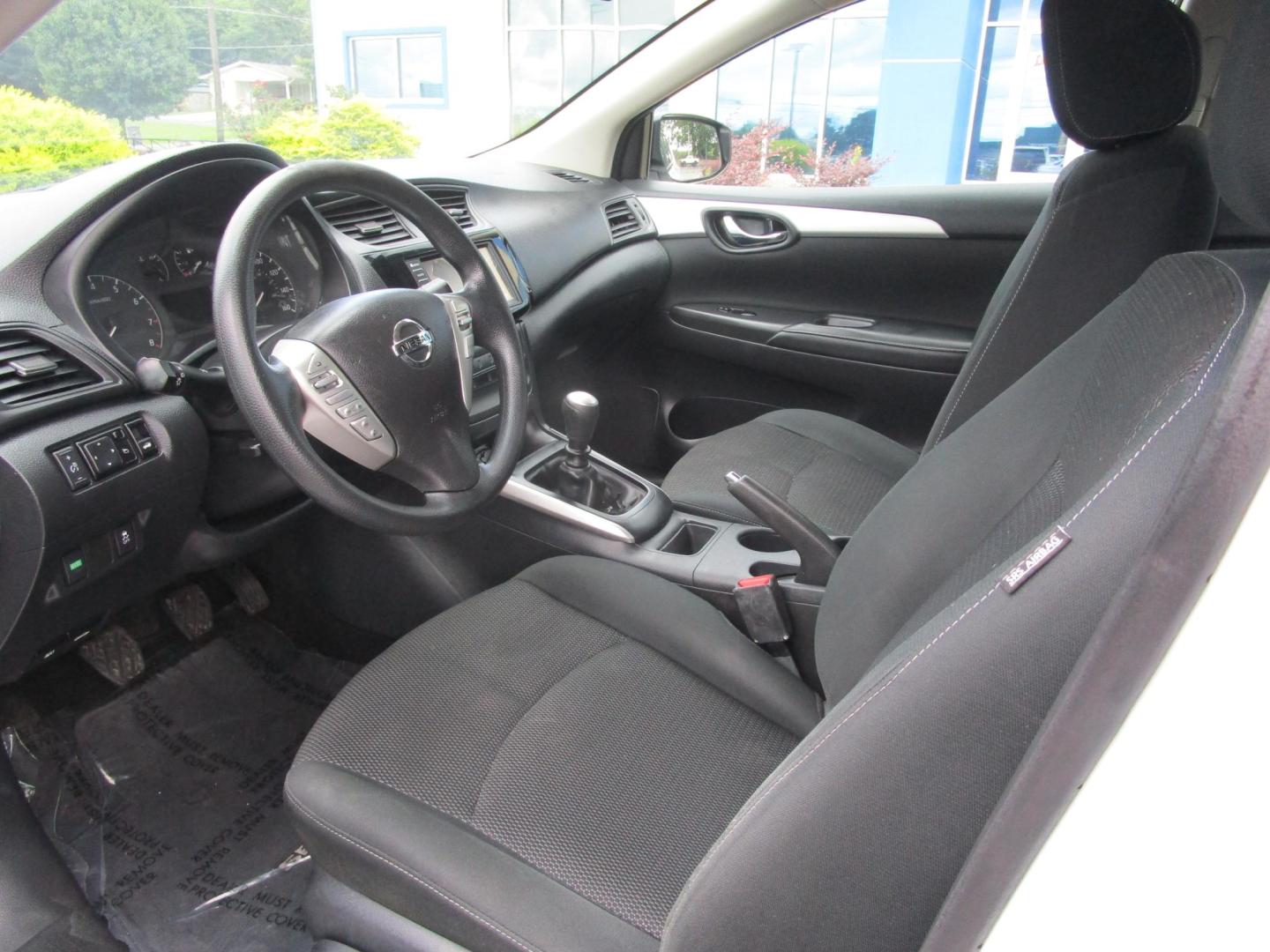 2019 WHITE /BLACK Nissan Sentra S CVT (3N1AB7AP3KY) with an 1.8L L4 SFI DOHC 16V engine, CVT transmission, located at 1814 Albert Pike Road, Hot Springs, AR, 71913, (501) 623-1717, 34.494228, -93.094070 - Mechanical & Performance Features: 1.8L DOHC 4-cylinder Engine. 6 Speed Manual transmission. Eco mode. Front and rear stabilizer bars. power-assisted vented front disc / rear drum brakes. Safety & Security Features: Lower anchors & tethers for children (Latch). Anti-lock braking system. Traction - Photo#7