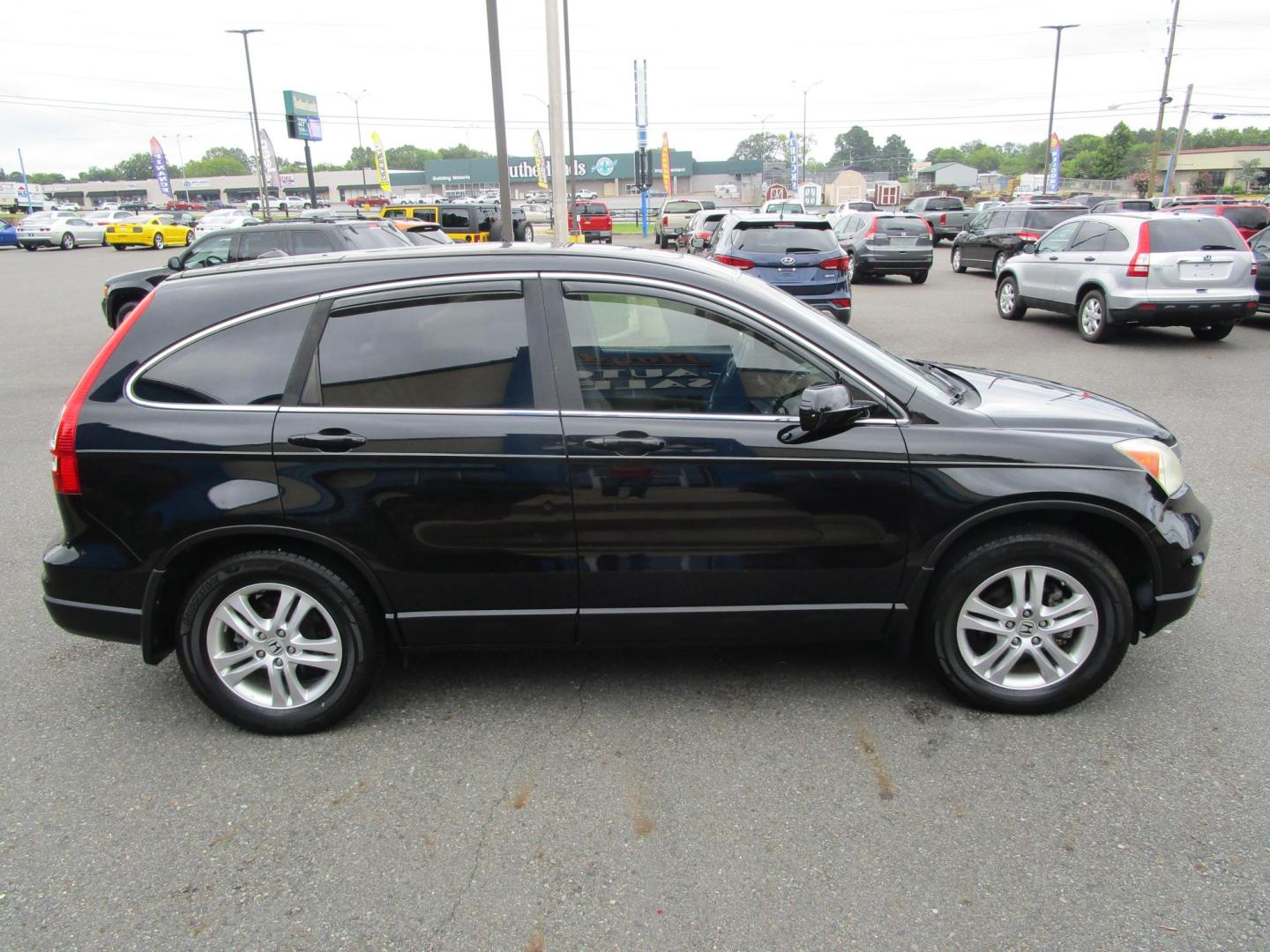 2011 BLACK /Tan / Leather Honda CR-V EX-L 4WD 5-Speed AT (5J6RE4H74BL) with an 2.4L L4 DOHC 16V engine, 5-Speed Automatic transmission, located at 1814 Albert Pike Road, Hot Springs, AR, 71913, (501) 623-1717, 34.494228, -93.094070 - Photo#4