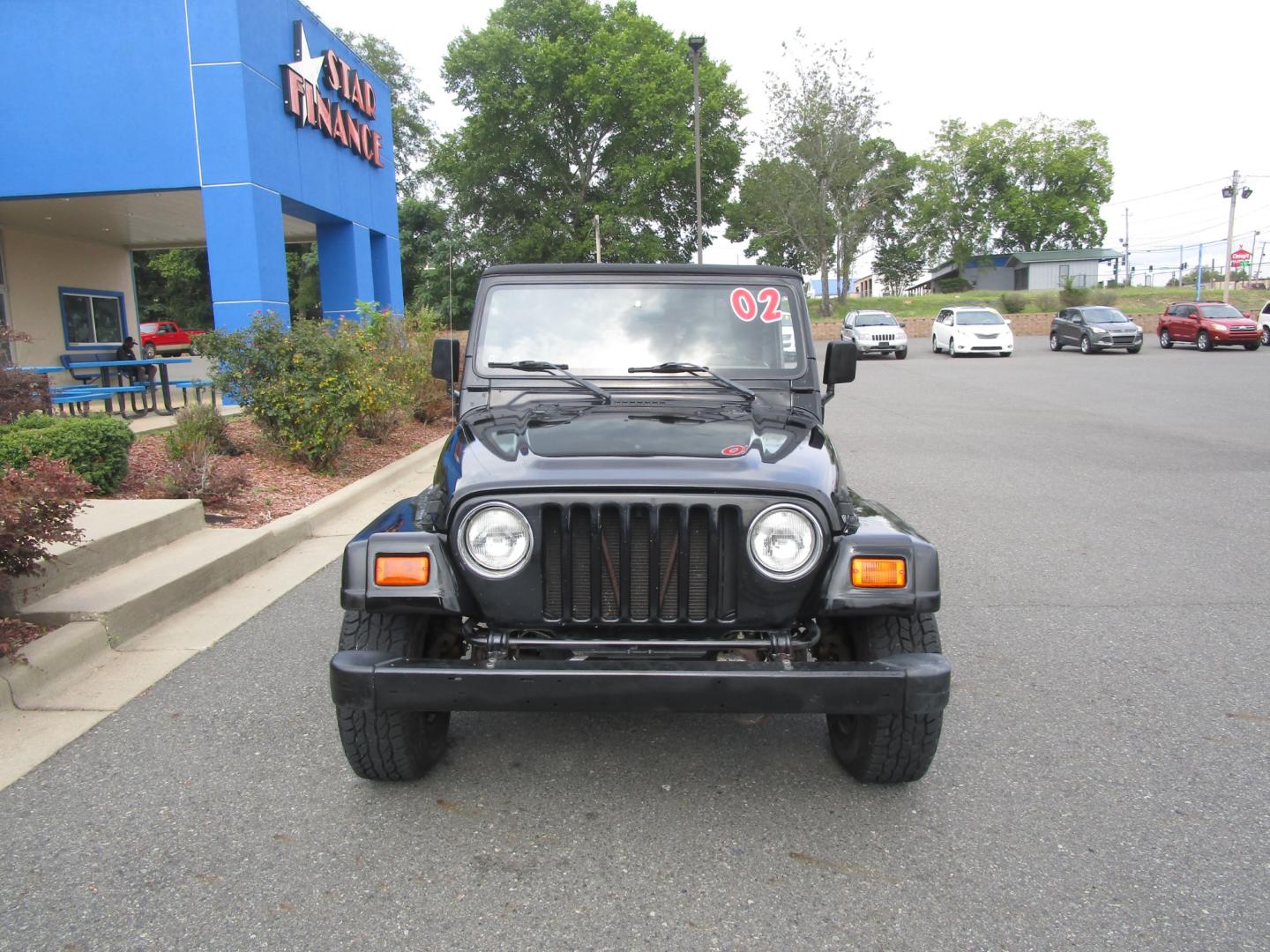 2002 BLACK /Black/Cloth Jeep Wrangler X (1J4FA39S42P) with an 4.0L L6 OHV 12V engine, located at 1814 Albert Pike Road, Hot Springs, AR, 71913, (501) 623-1717, 34.494228, -93.094070 - 2002 Jeep Wrangler X 4.0L 16 F Gasoline Rear Wheel Drive 4X4 5 Speed Manual - Photo#1