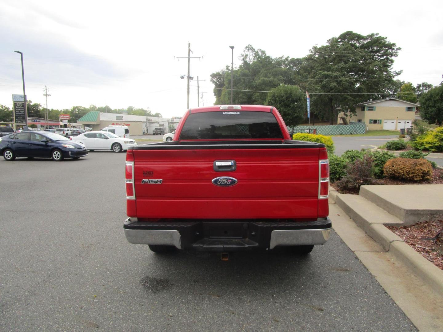 2009 RED /Tan / Cloth Ford F-150 Lariat SuperCab 5.5-ft. Bed 2WD (1FTRX12899K) , 4-Speed Automatic transmission, located at 1814 Albert Pike Road, Hot Springs, AR, 71913, (501) 623-1717, 34.494228, -93.094070 - 2009 Ford F-150 XLT 4 Door Extended Cab Pickup 4.6L V8 F SOHC 24V Gasoline Rear Wheel Drive - Photo#3