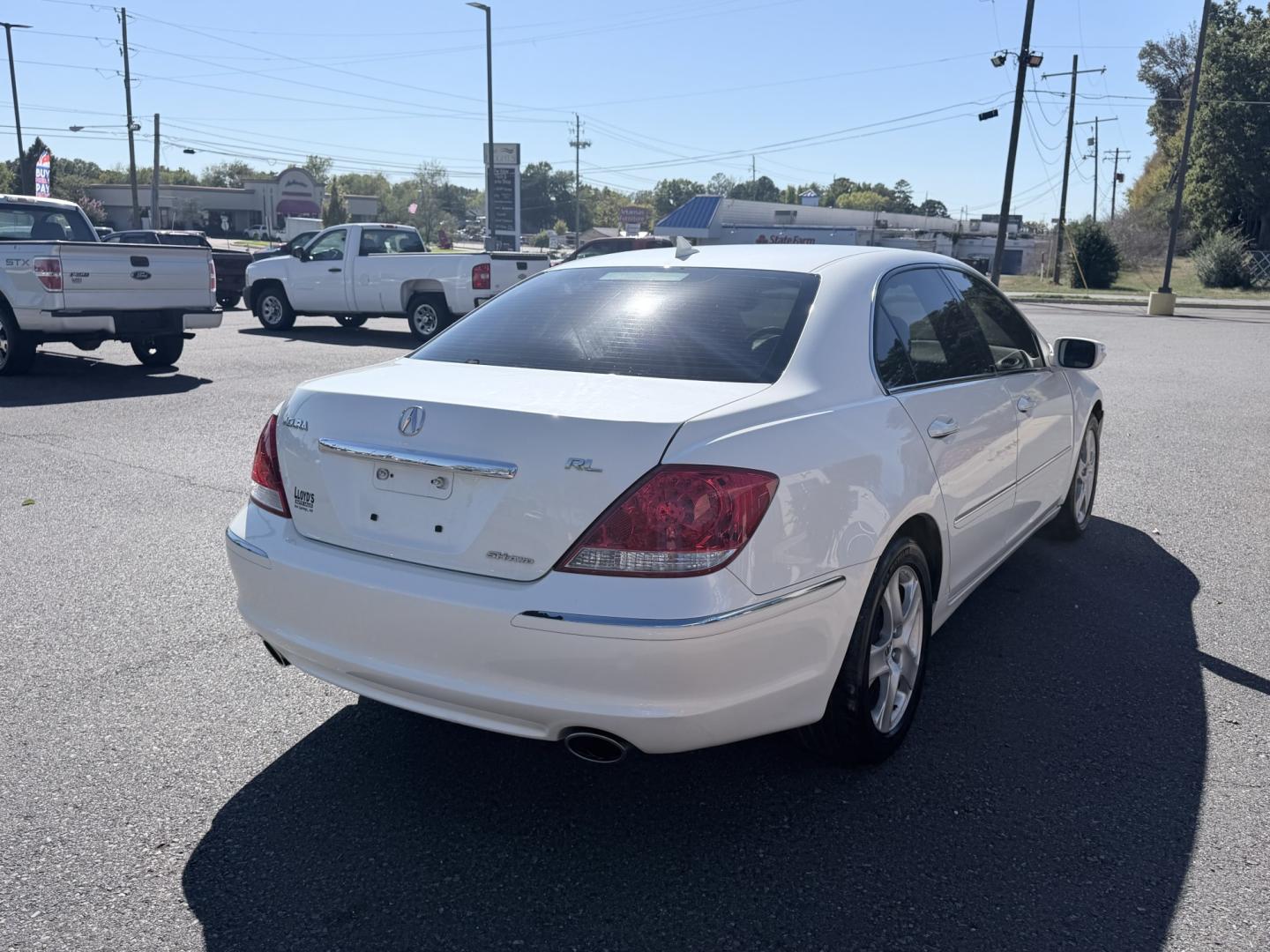 2006 WHITE /Tan / Leather Acura RL Sedan (JH4KB16566C) with an 3.5L V6 SOHC 24V engine, 5-Speed Automatic Overdrive transmission, located at 1814 Albert Pike Road, Hot Springs, AR, 71913, (501) 623-1717, 34.494228, -93.094070- Photo#2