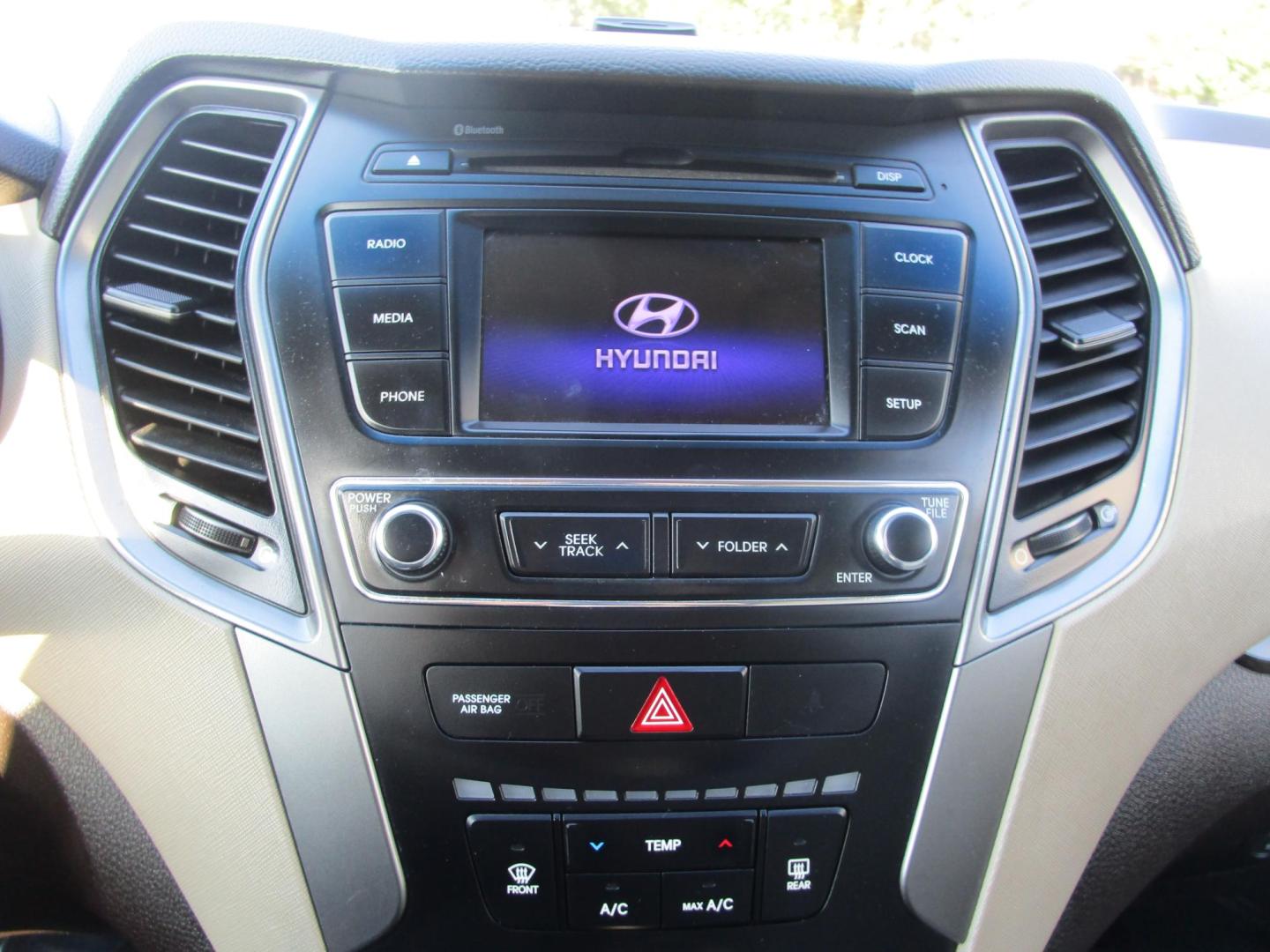 2018 Blue /TAN Hyundai Santa Fe Sport 2.4 FWD (5XYZT3LB6JG) with an 2.4L L4 DOHC 16V engine, 6A transmission, located at 1814 Albert Pike Road, Hot Springs, AR, 71913, (501) 623-1717, 34.494228, -93.094070 - 2018 Hyundai Santa Fe Sport 2.4 FWD 4 Door SUV 2.4L I4 F DOHC 16V Gasoline Front Wheel Drive - Photo#4