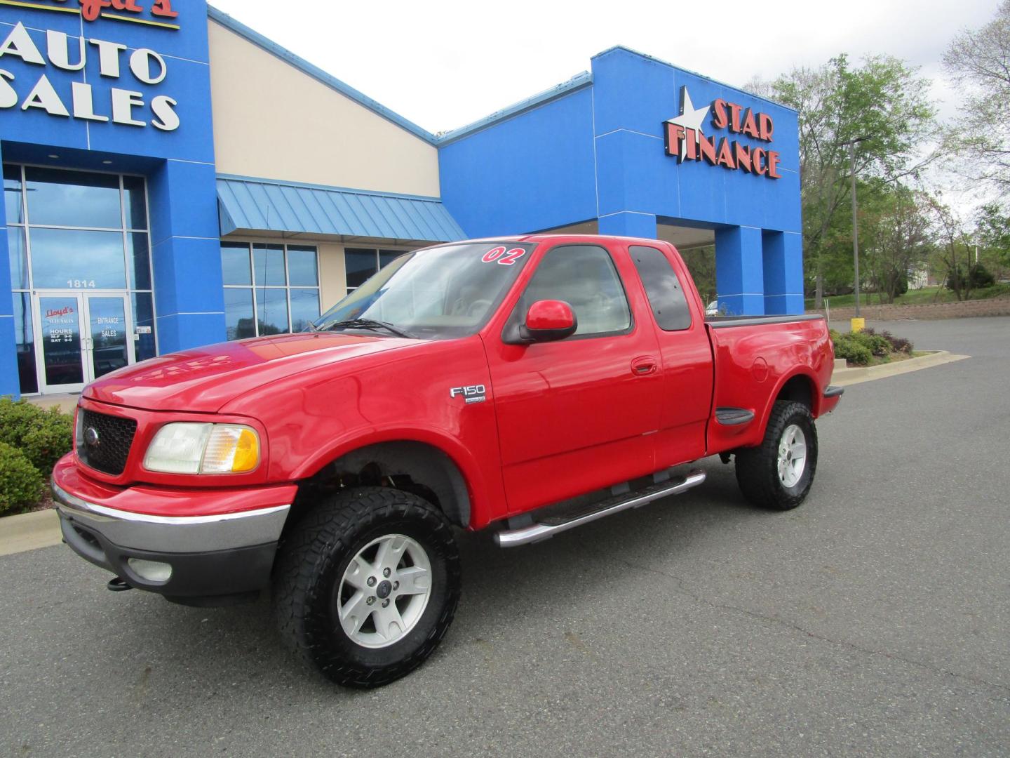 2002 RED /Tan / Leather Ford F-150 Lariat SuperCab Flareside 4WD (2FTRX08L42C) with an 5.4L V8 SOHC 16V engine, 4-Speed Automatic Overdrive transmission, located at 1814 Albert Pike Road, Hot Springs, AR, 71913, (501) 623-1717, 34.494228, -93.094070 - Photo#1