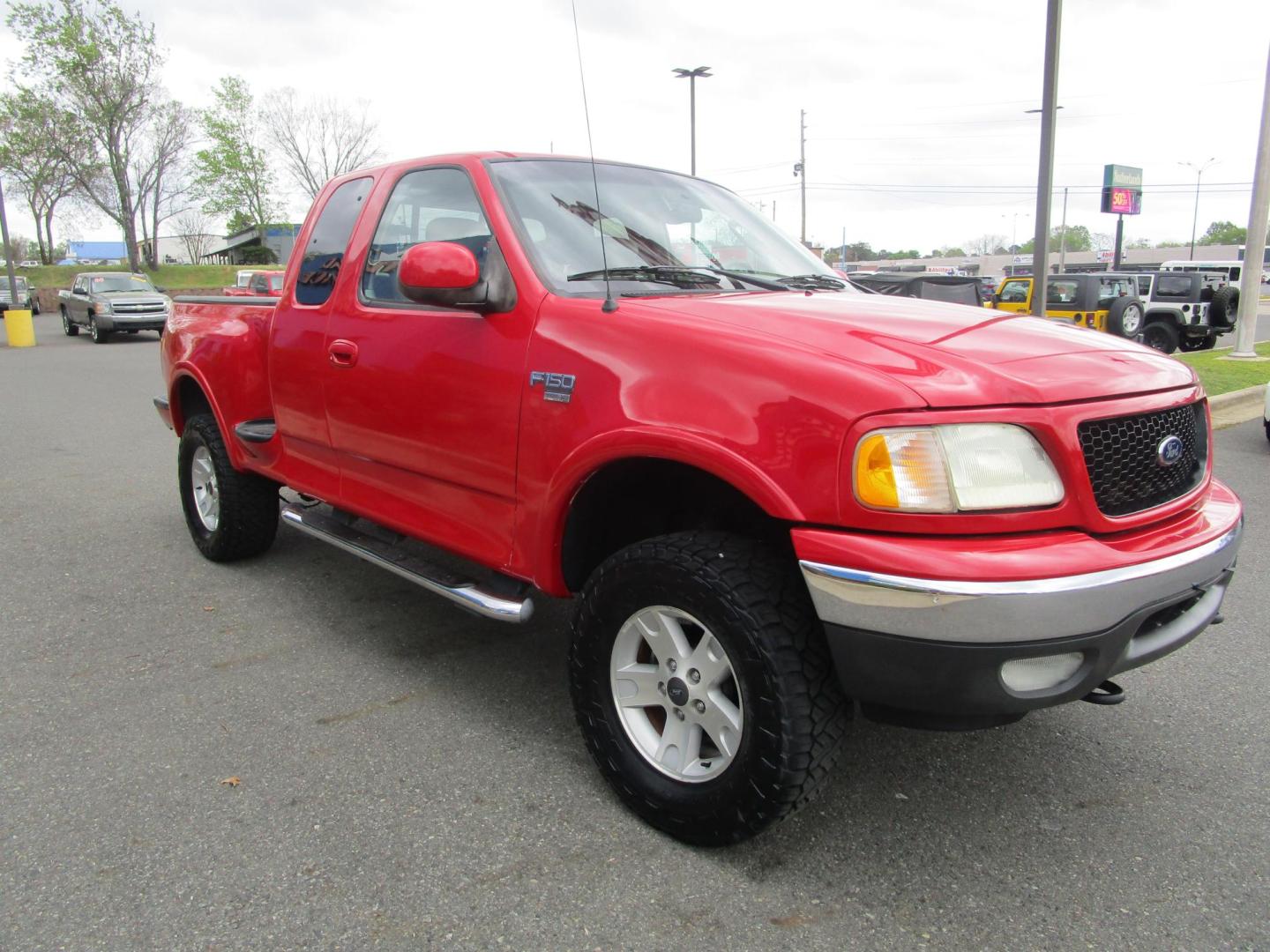 2002 RED /Tan / Leather Ford F-150 Lariat SuperCab Flareside 4WD (2FTRX08L42C) with an 5.4L V8 SOHC 16V engine, 4-Speed Automatic Overdrive transmission, located at 1814 Albert Pike Road, Hot Springs, AR, 71913, (501) 623-1717, 34.494228, -93.094070 - Photo#3