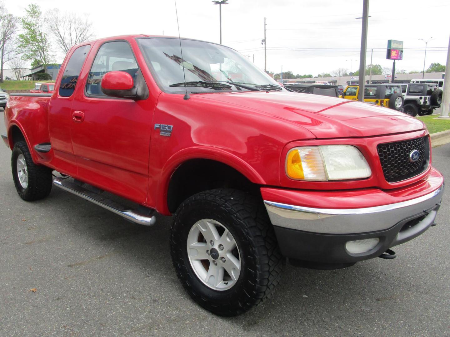2002 RED /Tan / Leather Ford F-150 Lariat SuperCab Flareside 4WD (2FTRX08L42C) with an 5.4L V8 SOHC 16V engine, 4-Speed Automatic Overdrive transmission, located at 1814 Albert Pike Road, Hot Springs, AR, 71913, (501) 623-1717, 34.494228, -93.094070 - Photo#3