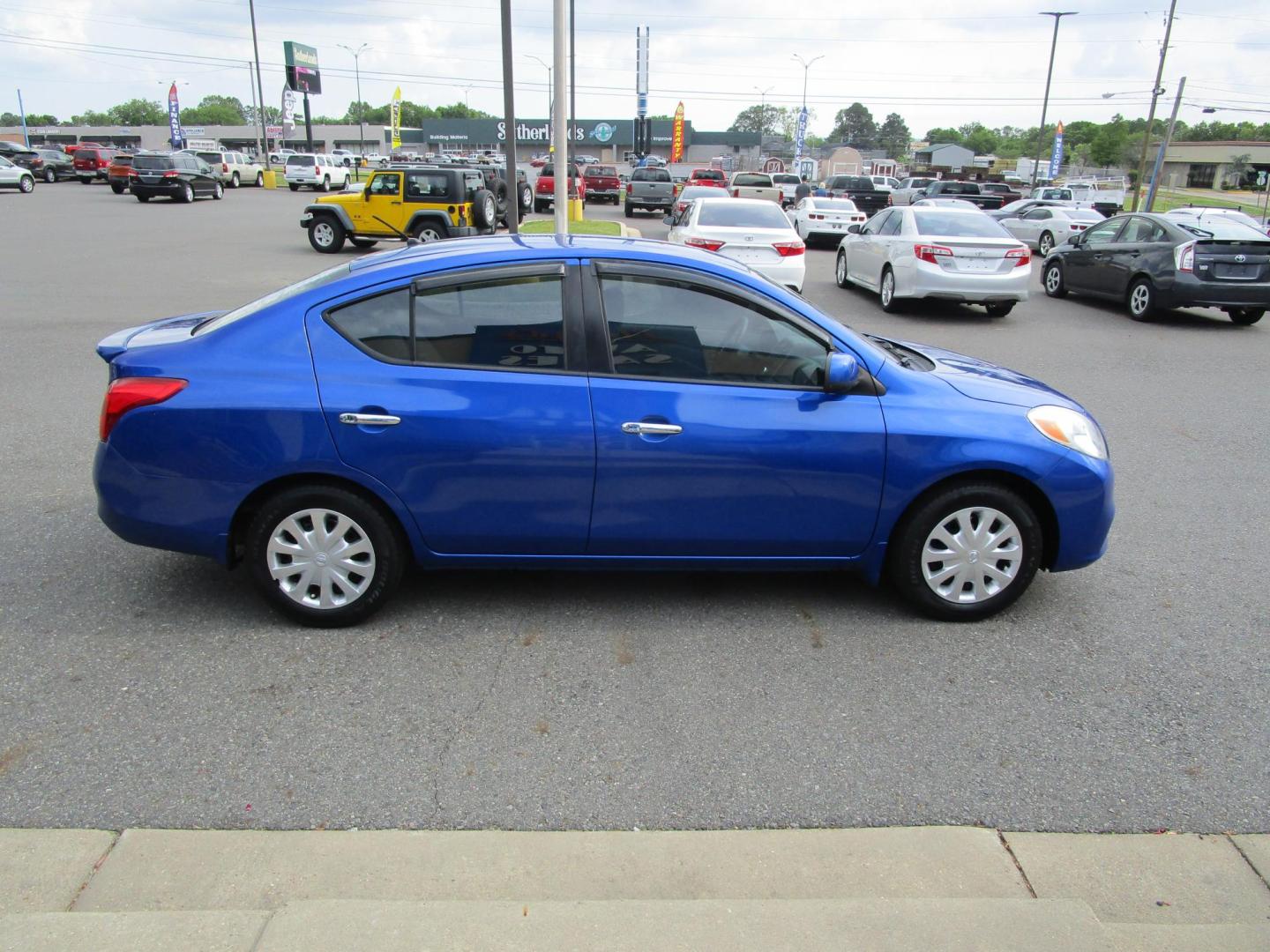 2012 Blue /Tan Nissan Versa 1.6 S Sedan (3N1CN7AP4CL) with an 1.6L L4 DOHC 16V engine, 5-Speed Manual transmission, located at 1814 Albert Pike Road, Hot Springs, AR, 71913, (501) 623-1717, 34.494228, -93.094070 - Photo#4