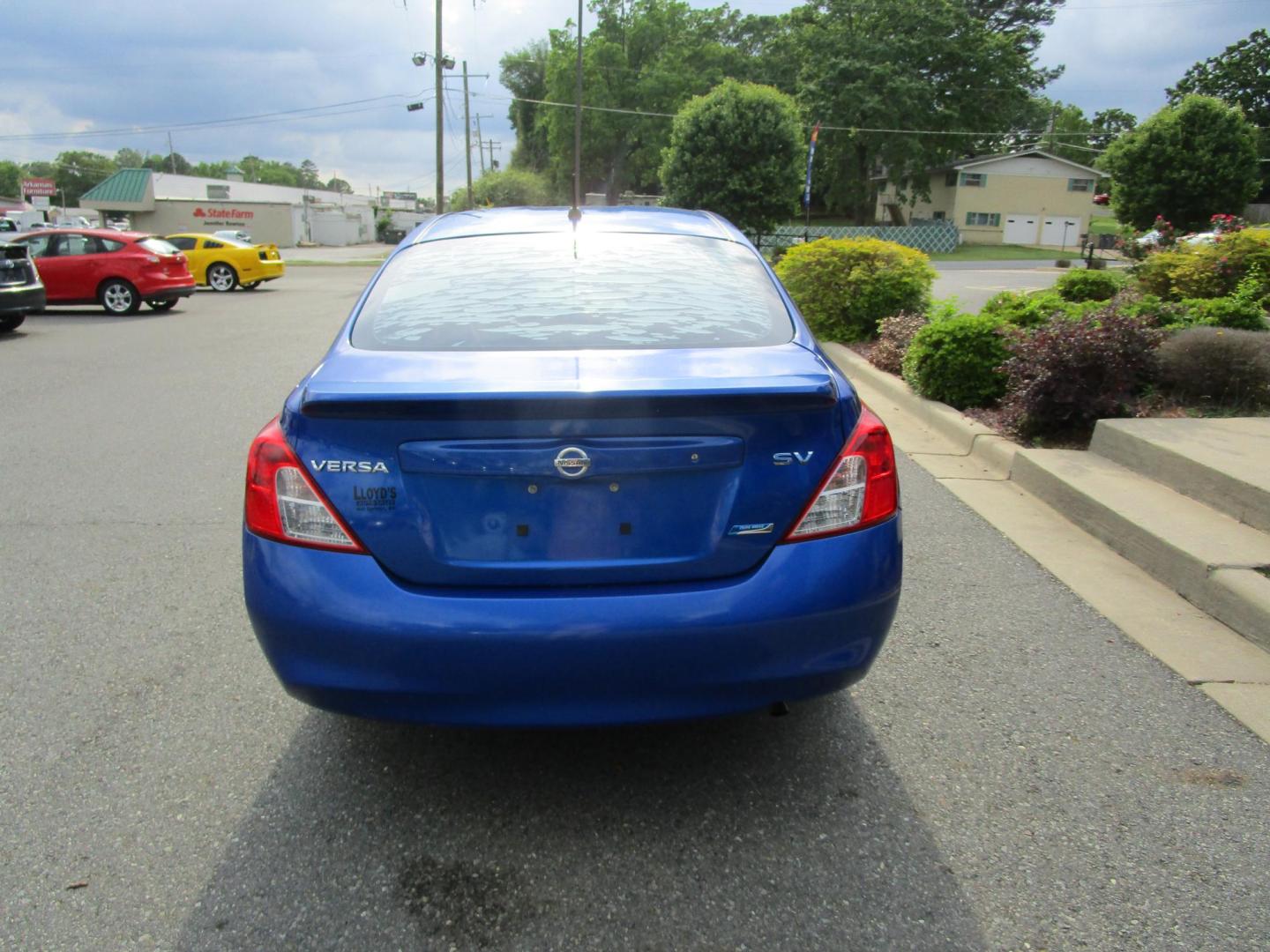 2012 Blue /Tan Nissan Versa 1.6 S Sedan (3N1CN7AP4CL) with an 1.6L L4 DOHC 16V engine, 5-Speed Manual transmission, located at 1814 Albert Pike Road, Hot Springs, AR, 71913, (501) 623-1717, 34.494228, -93.094070 - Photo#5