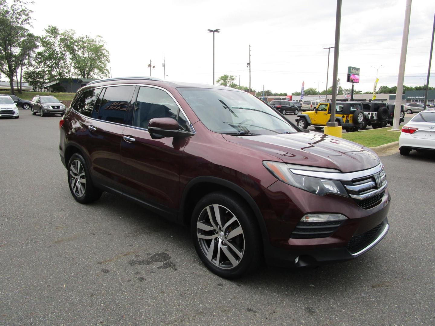 2017 MAROON /Tan / Leather Honda Pilot Touring (5FNYF6H95HB) with an 3.5L V6 SOHC 24V engine, 9A transmission, located at 1814 Albert Pike Road, Hot Springs, AR, 71913, (501) 623-1717, 34.494228, -93.094070 - Photo#3