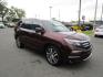 2017 MAROON /Tan / Leather Honda Pilot Touring (5FNYF6H95HB) with an 3.5L V6 SOHC 24V engine, 9A transmission, located at 1814 Albert Pike Road, Hot Springs, AR, 71913, (501) 623-1717, 34.494228, -93.094070 - Photo#3