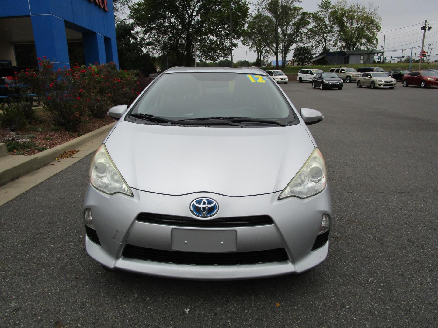 2012 SILVER Toyota Prius c One (JTDKDTB39C1) with an 1.5L L4 DOHC 16V HYBRID engine, Continuously Variable Transmission transmission, located at 1814 Albert Pike Road, Hot Springs, AR, 71913, (501) 623-1717, 34.494228, -93.094070 - Photo#2