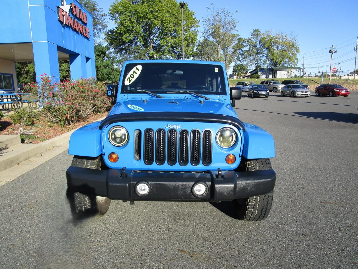 2011 Blue /Black/Cloth Jeep Wrangler Unlimited Sahara 4WD (1J4BA5H10BL) with an 3.8L V6 OHV 12V engine, located at 1814 Albert Pike Road, Hot Springs, AR, 71913, (501) 623-1717, 34.494228, -93.094070 - Photo#2