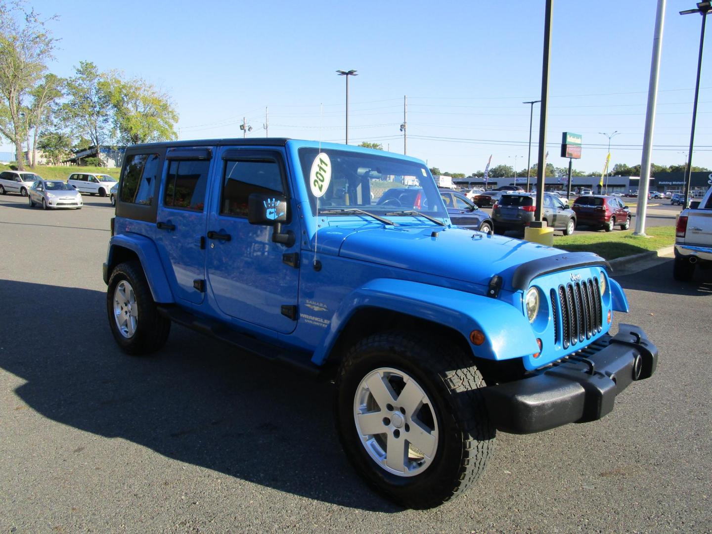 2011 Blue /Black/Cloth Jeep Wrangler Unlimited Sahara 4WD (1J4BA5H10BL) with an 3.8L V6 OHV 12V engine, located at 1814 Albert Pike Road, Hot Springs, AR, 71913, (501) 623-1717, 34.494228, -93.094070 - Photo#3