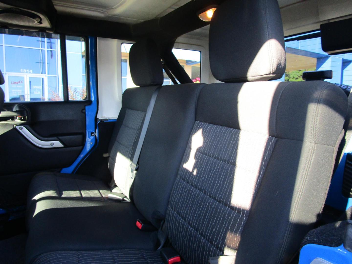 2011 Blue /Black/Cloth Jeep Wrangler Unlimited Sahara 4WD (1J4BA5H10BL) with an 3.8L V6 OHV 12V engine, located at 1814 Albert Pike Road, Hot Springs, AR, 71913, (501) 623-1717, 34.494228, -93.094070 - Photo#7