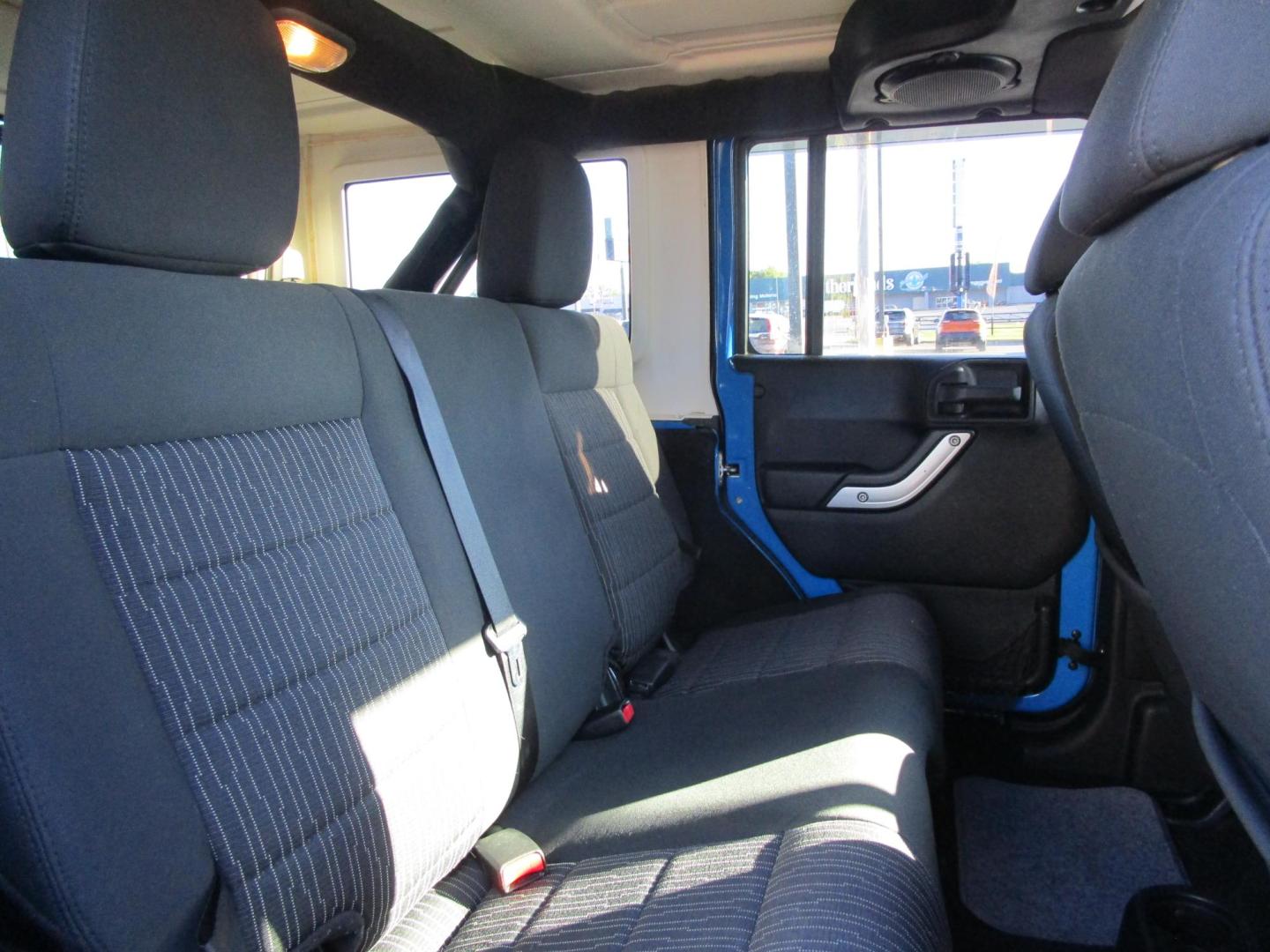 2011 Blue /Black/Cloth Jeep Wrangler Unlimited Sahara 4WD (1J4BA5H10BL) with an 3.8L V6 OHV 12V engine, located at 1814 Albert Pike Road, Hot Springs, AR, 71913, (501) 623-1717, 34.494228, -93.094070 - Photo#8