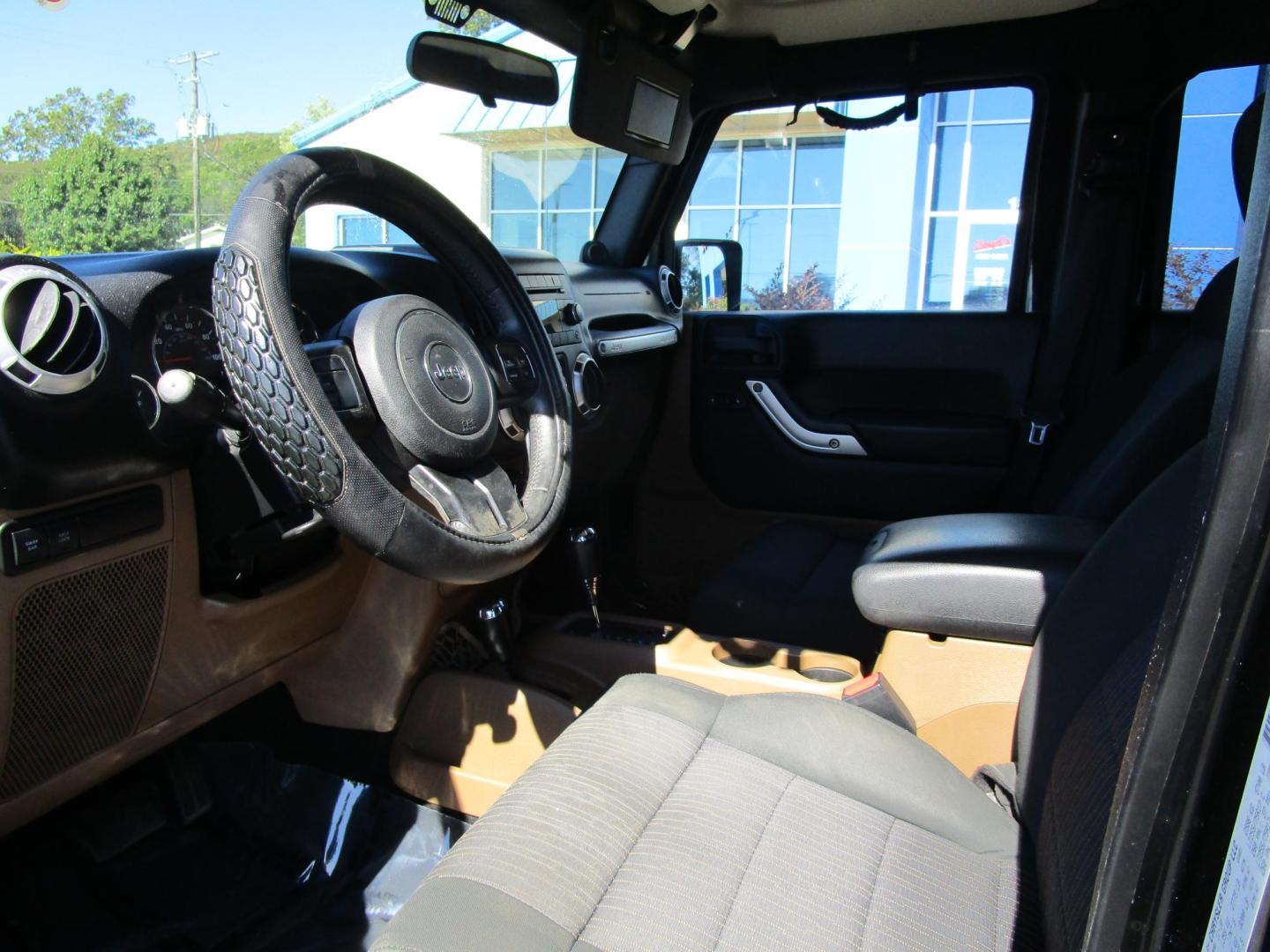 2011 BLACK /BLACK Jeep Wrangler Unlimited Rubicon 4WD (1J4BA6H18BL) with an 3.8L V6 OHV 12V engine, AUTOMATIC transmission, located at 1814 Albert Pike Road, Hot Springs, AR, 71913, (501) 623-1717, 34.494228, -93.094070 - Photo#6