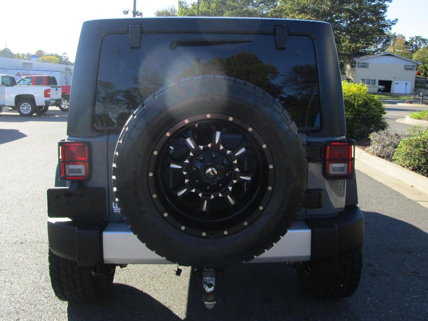 2014 GRAY /Black / Leather Jeep Wrangler Unlimited Sahara 4WD (1C4BJWEG8EL) with an 3.6L V6 DOHC 24V FFV engine, AUTOMATIC transmission, located at 1814 Albert Pike Road, Hot Springs, AR, 71913, (501) 623-1717, 34.494228, -93.094070 - Photo#5