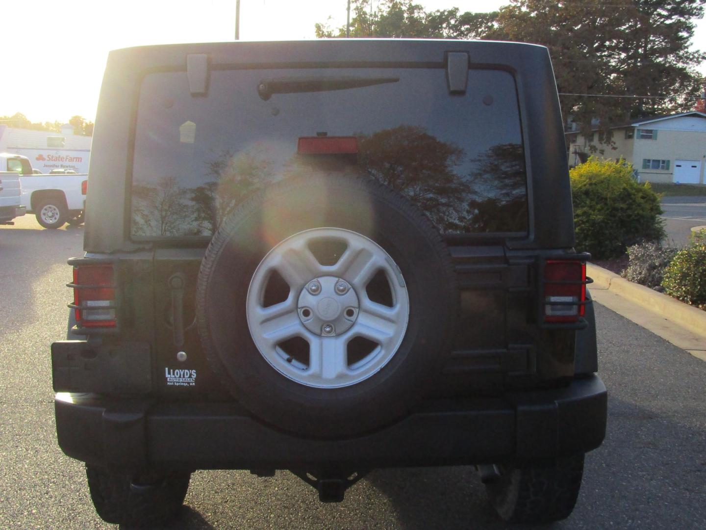 2013 BLACK /BLACK Jeep Wrangler Unlimited Sport 4WD (1C4BJWDG4DL) with an 3.6L V6 DOHC 24V FFV engine, 6-SPEED MANUAL transmission, located at 1814 Albert Pike Road, Hot Springs, AR, 71913, (501) 623-1717, 34.494228, -93.094070 - Photo#5