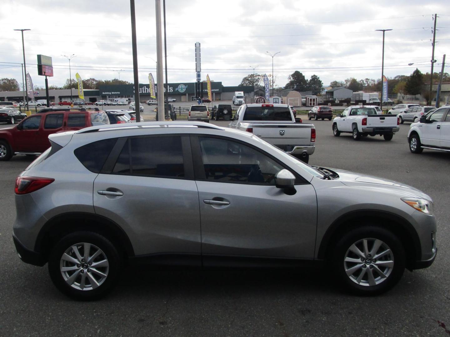 2014 SILVER /BLACK Mazda CX-5 Touring (JM3KE2CY8E0) with an 2.5L L4 DOHC 16V engine, 6-Speed Automatic transmission, located at 1814 Albert Pike Road, Hot Springs, AR, 71913, (501) 623-1717, 34.494228, -93.094070 - Photo#4