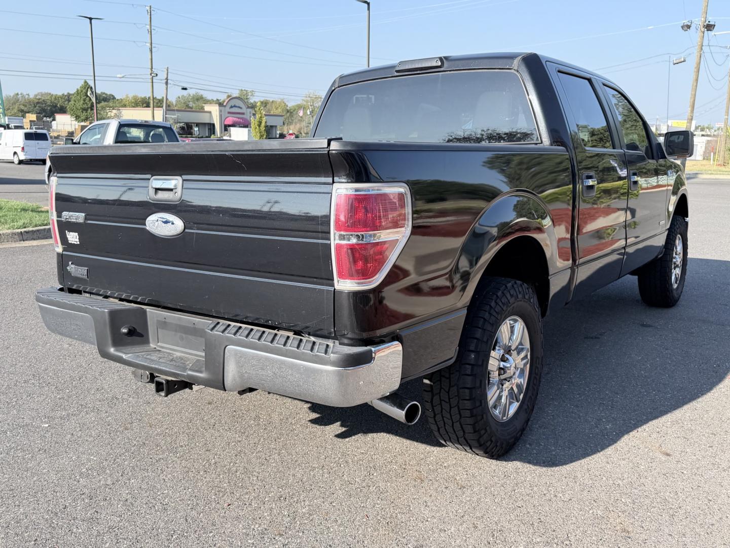2011 BLACK Ford F-150 FX4 SuperCrew 5.5-ft. Bed 4WD (1FTFW1ET6BF) with an 3.5L V6 engine, 4-Speed Automatic transmission, located at 1814 Albert Pike Road, Hot Springs, AR, 71913, (501) 623-1717, 34.494228, -93.094070- Photo#2